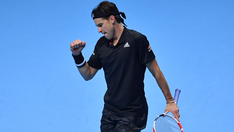 Austria's Dominic Thiem reacts to winning a game against Greece's Stefanos Tsitsipas in their men's singles round-robin match on day one of the ATP World Tour Finals tennis tournament at the O2 Arena in London on November 15, 2020