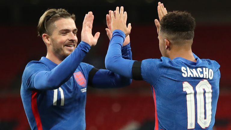 Jack Grealish and Jadon Sancho celebrate England's second goal