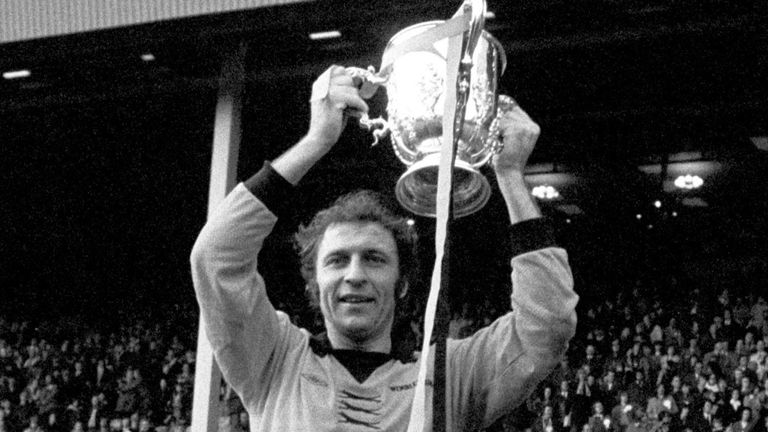 Wolves players carry captain Mike Bailey, holding the League Cup trophy in 1974