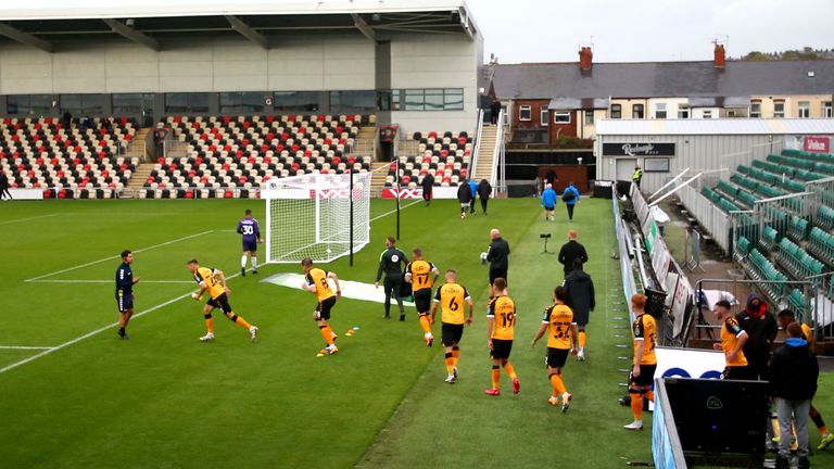 Newport County players enter the pitch for their Carabao Cup tie against Newcastle United at Rodney Parade