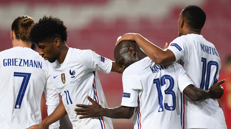 France's midfielder N'Golo Kante (2R) celebrates his goal with teammates during the UEFA Nations League A group 3 football match between Portugal and France at the Luz stadium in Lisbon on November 14, 2020.