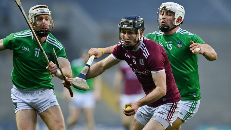 Padraic Mannion of Galway in action against Cian Lynch and Aaron Gillane of Limerick