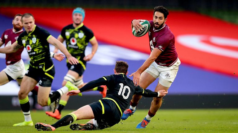 Giorgi Kveseladze breaks past Ireland's Billy Burns on his way to scoring his side's first try