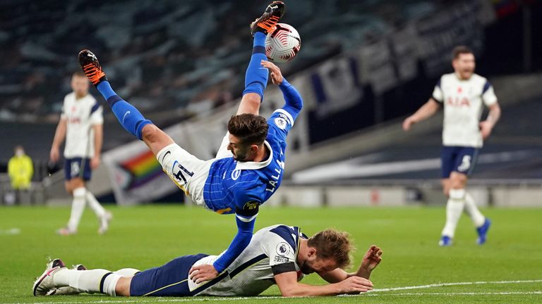 Harry Kane goes down under pressure from Brighton's Adam Lallana leading to a penalty for Spurs