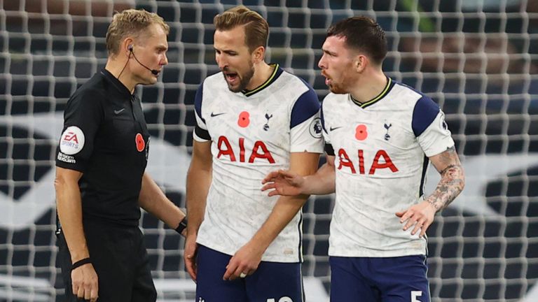 Harry Kane and Pierre-Emile Hojbjerg speak to referee Graham Scott,after Brighton's equaliser