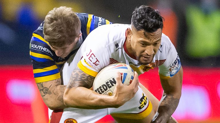 Picture by Allan McKenzie/SWpix.com - 13/11/2020 - Rugby League - Betfred Super League Playoff - Catalans Dragons v Leeds Rhinos - Halliwell Jones Stadium, Warrington, England - Catalans's Israel Folau is tackled by Leeds's Liam Sutcliffe.