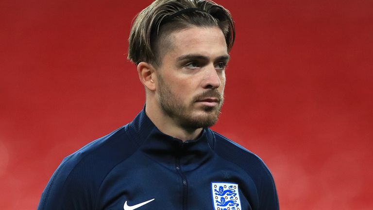 Jack Grealish of England(R) looks on during the national anthems during the international friendly match between England and the Republic of Ireland at Wembley Stadium on November 12, 2020 in London, England. Sporting stadiums around the UK remain under strict restrictions due to the Coronavirus Pandemic as Government social distancing laws prohibit fans inside venues resulting in games being played behind closed doors. (Photo by Mike Egerton - Pool/Getty Images)