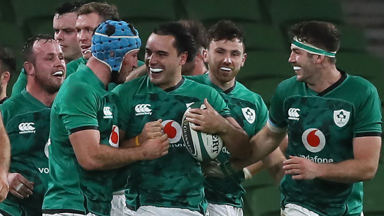 Ireland's wing James Lowe (C) celebrates with teammates after scoring a late try against Wales