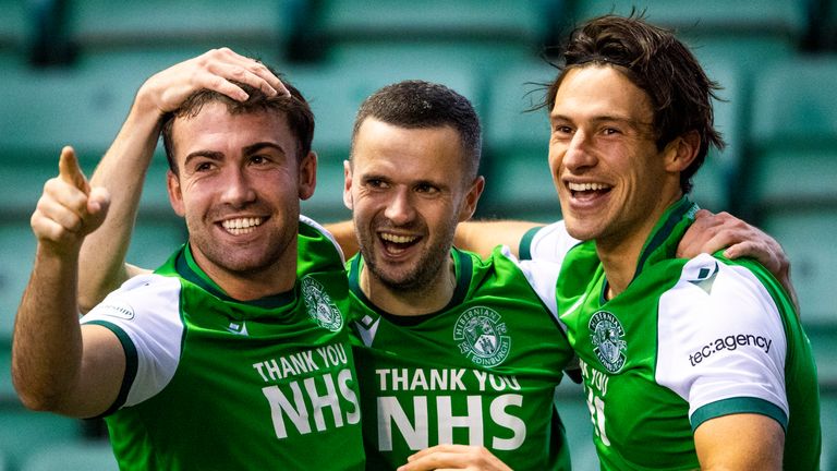 Jamie Murphy celebrates with Steven Mallan and Joe Newell celebrate Hibernian's opener