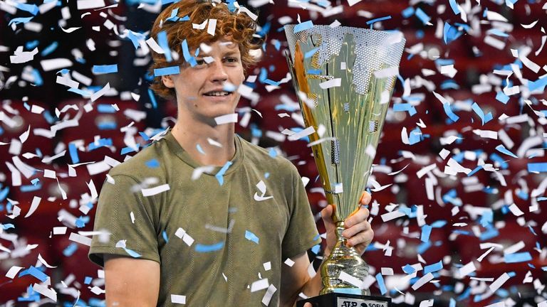 Italian tennis player Jannik Sinner celebrates with the trophy during the podium ceremony after winning the final against his Canadian opponent at the ATP 250 Sofia Open tennis tournament in Sofia, on November 14, 2020. 