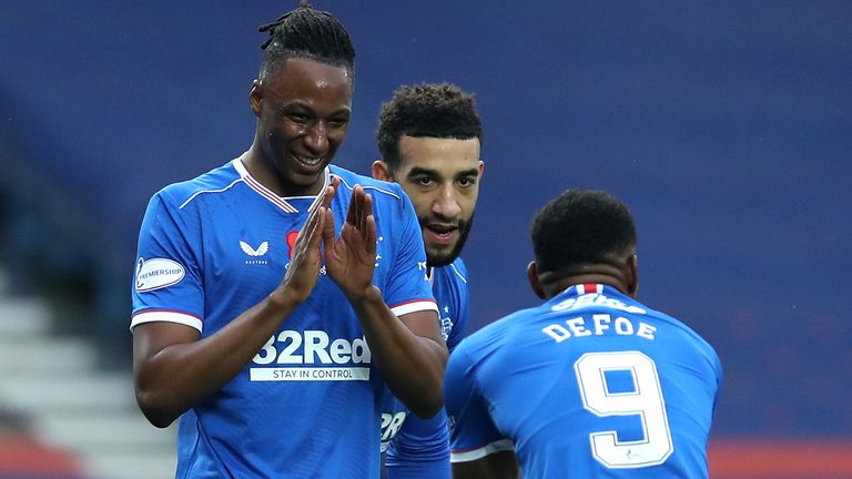 Joe Aribo celebrates scoring Rangers' third goal with Jermaine Defoe