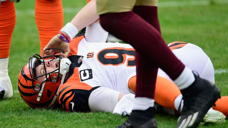 Joe Burrow #9 of the Cincinnati Bengals is injured during the third quarter against the Washington Football Team at FedExField on November 22, 2020 in Landover, Maryland