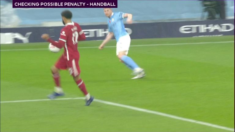 Joe Gomez was penalised for this handball in the first half