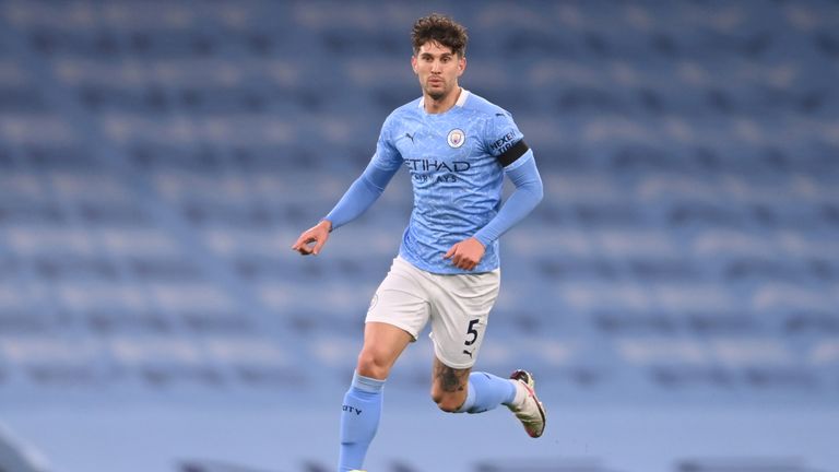 Manchester City's English defender John Stones runs with the ball during the English Premier League football match between Manchester City and Burnley at the Etihad Stadium in Manchester, north west England, on November 28, 2020