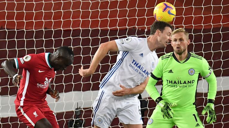 Jonny Evans scores an own goal under pressure from Sadio Mane