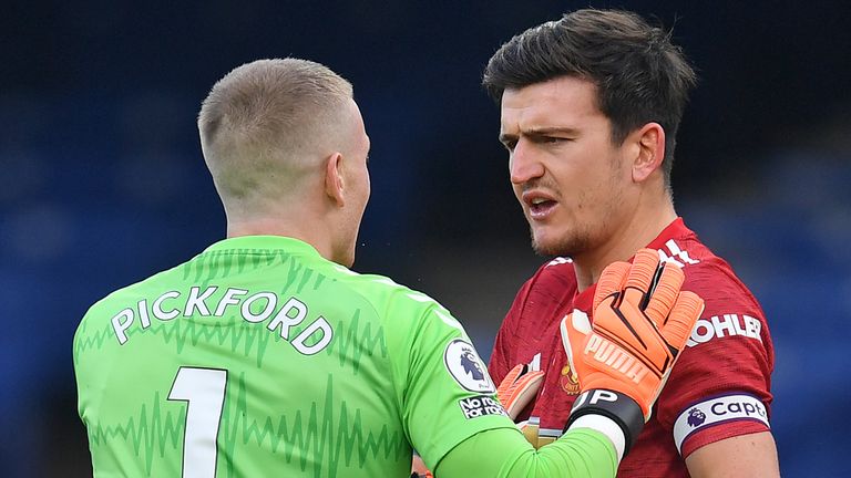 Jordan Pickford and Harry Maguire have words after the Everton goalkeeper kicked the Manchester United captain but avoided VAR action