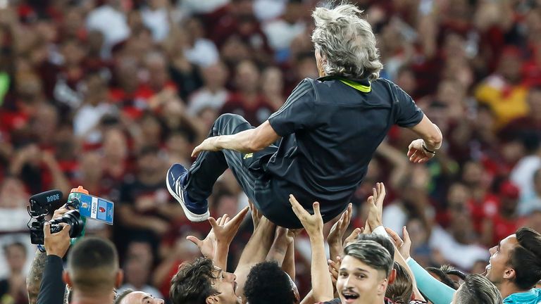 RIO DE JANEIRO, BRAZIL - NOVEMBER 27: Players of Flamengo hold the coach Jorge Jesus after winning the Brasileirao 2019 after the match against Cear.. at Maracana Stadium on November 27, 2019 in Rio de Janeiro, Brazil.