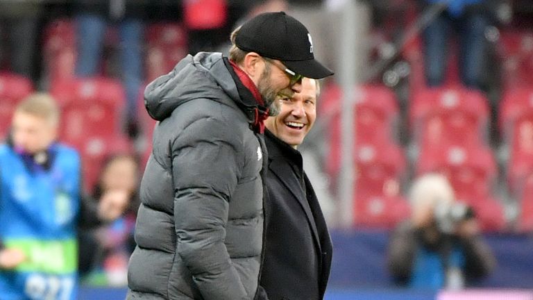 Liverpool's Jurgen Klopp shares a joke with Red Bull Salzburg head coach Jesse Marsch
