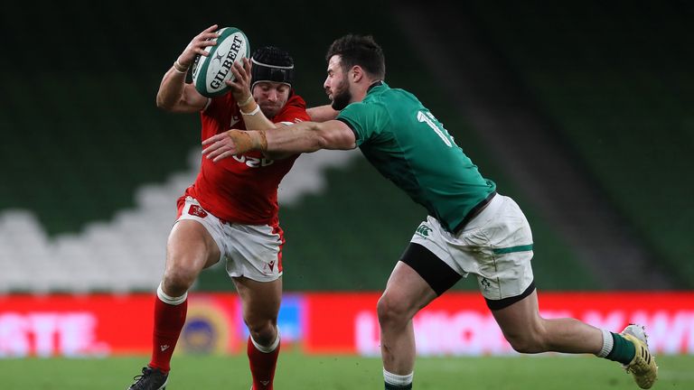 Leigh Halfpenny tries to get through the tackle of Robbie Henshaw