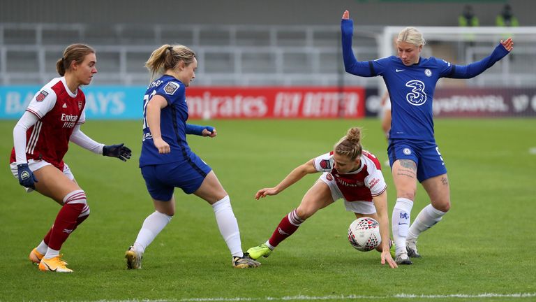 Maier is challenged by Bethany England during a goalless first half