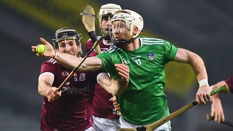 Cian Lynch of Limerick in action against Padraic Mannion of Galway