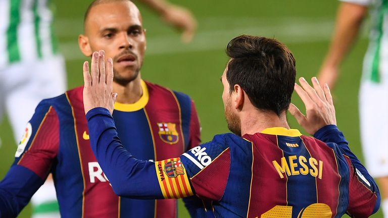 Lionel Messi is congratulated after netting against Real Betis