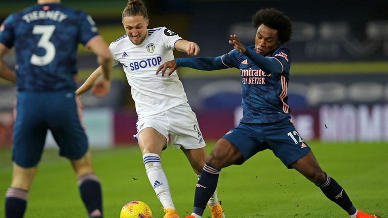 Luke Ayling and Willian compete for possession early in the first half