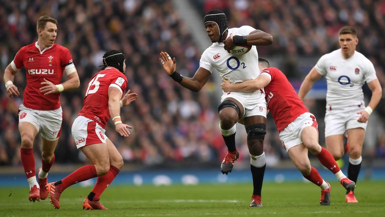 Maro Itoje of England attempts to hold off Leigh Halfpenny of Wales during the 2020 Guinness Six Nations match between England and Wales at Twickenham Stadium on March 07, 2020 in London, England. 