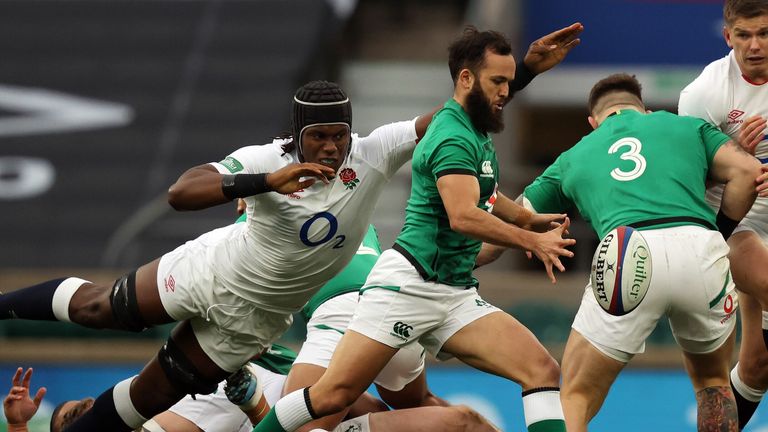 Maro Itoje (L) tackles as Ireland's scrum-half James Gibson-Park