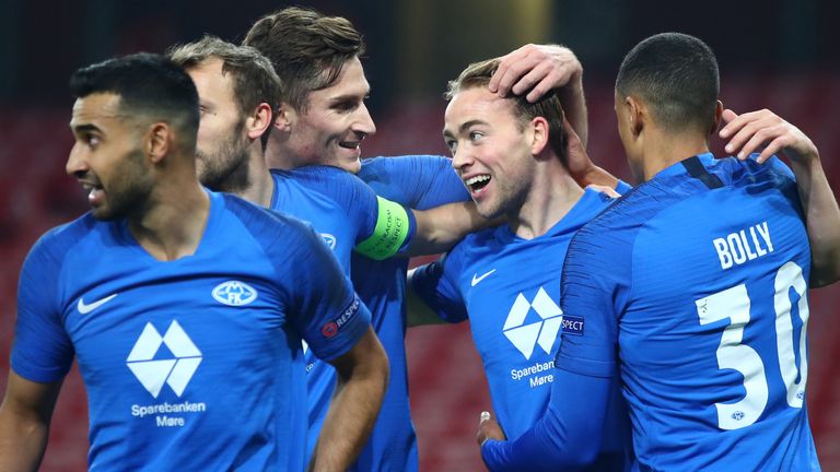 Molde players celebrate after Martin Ellingsen put them ahead at Arsenal