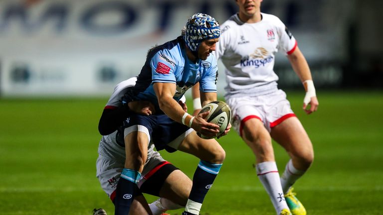 Matthew Morgan of Cardiff Blues is tackled by Louis Ludik