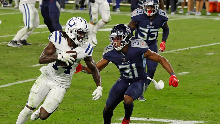 Zach Pascal #14 of the Indianapolis Colts is pursued by Kevin Byard #31 of the Tennessee Titans during the second half of a game at Nissan Stadium on November 12, 2020 in Nashville, Tennessee. 