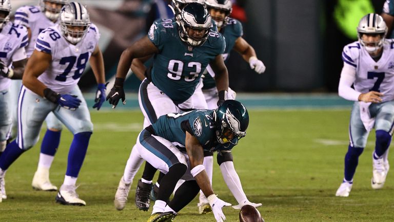 Rodney McLeod #23 of the Philadelphia Eagles reaches down to pick up the fumbled ball in the fourth quarter of the game against the Dallas Cowboys at Lincoln Financial Field on November 01, 2020 in Philadelphia, Pennsylvania. McLeod returned the fumble for a touchdown. The Eagles defeated the Cowboys 23-9. 