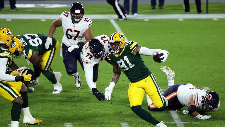 Preston Smith #91 of the Green Bay Packers runs a fumble recovery back for a touchdown during the 1st half of the game against the Chicago Bears at Lambeau Field on November 29, 2020 in Green Bay, Wisconsin. 