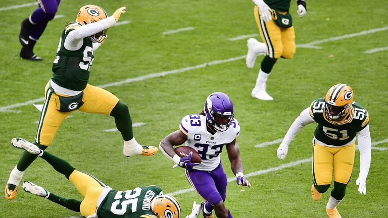 Dalvin Cook #33 of the Minnesota Vikings scores a touchdown during the first quarter against the Green Bay Packers at Lambeau Field on November 01, 2020 in Green Bay, Wisconsin.