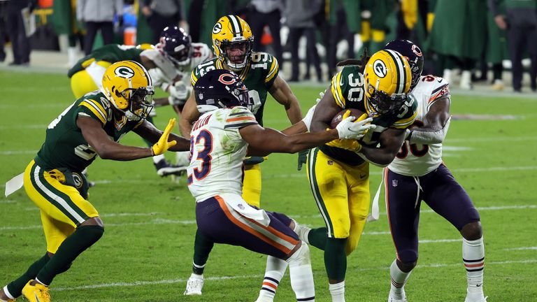 Jamaal Williams #30 of the Green Bay Packers carries the ball into the end zone for a touchdown during the 2nd half of the game against the Chicago Bears at Lambeau Field on November 29, 2020 in Green Bay, Wisconsin. 
