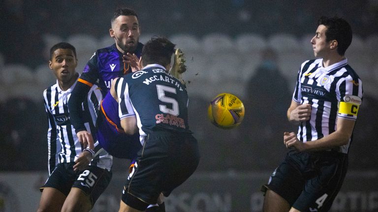 Dundee United's Nicky Clark is swarmed by St Mirren players