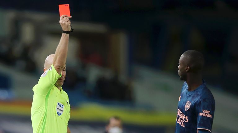 Nicolas Pepe is shown a red card by referee Anthony Taylor