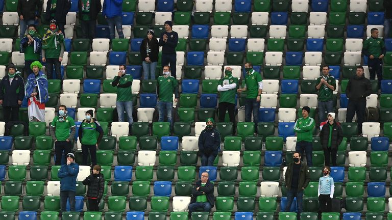 Fans look on from the stands socially distanced during the UEFA EURO 2020 Play-Off Final between Northern Ireland and Slovakia at Windsor Park on November 12, 2020 in Belfast, Northern Ireland. 