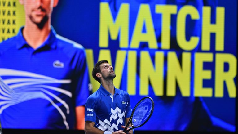 Serbia's Novak Djokovic reacts after winning in straight sets against Argentina's Diego Schwartzman in their men's singles round-robin match on day two of the ATP World Tour Finals tennis tournament at the O2 Arena in London on November 16, 2020.