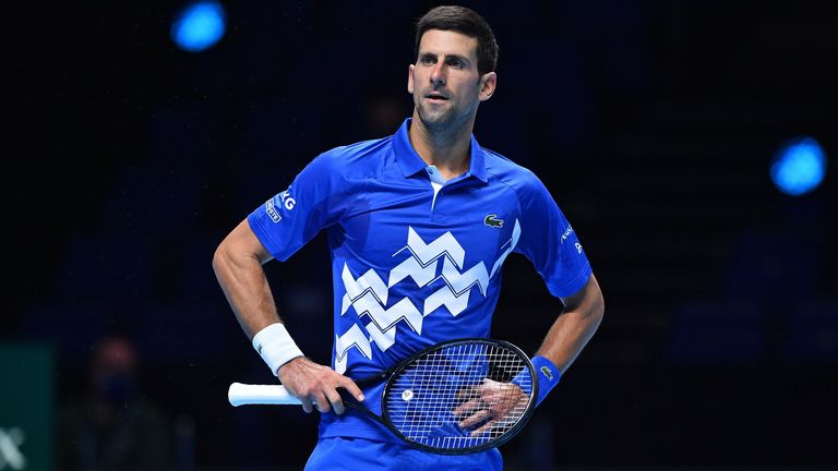 Serbia's Novak Djokovic reacts as he plays Germany's Alexander Zverev during their men's singles round-robin match on day six of the ATP World Tour Finals tennis tournament at the O2 Arena in London on November 20, 2020.