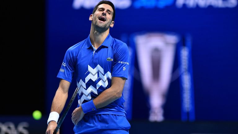 Novak Djokovic reacts as he plays against Austria's Dominic Thiem during their men's singles semi-final match on day seven of the ATP World Tour Finals tennis tournament at the O2 Arena in London on November 21, 2020.