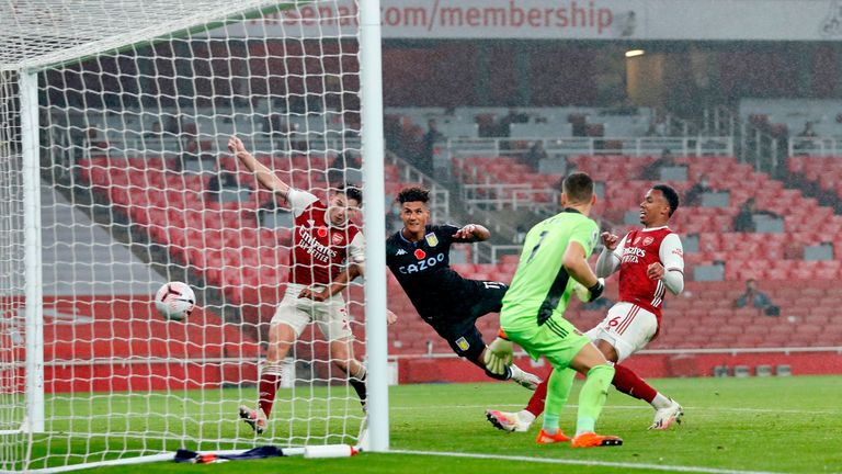 Watkins heads in the first of his two goals over a dreadful Arsenal