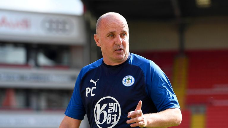 Paul Cook, Manager of Wigan Athletic reacts following the Sky Bet Championship match between Barnsley and Wigan Athletic at Oakwell Stadium on July 11, 2020 in Barnsley, England. Football Stadiums around Europe remain empty due to the Coronavirus Pandemic as Government social distancing laws prohibit fans inside venues resulting in all fixtures being played behind closed doors