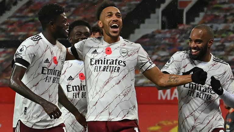 Pierre-Emerick Aubameyang (C) celebrates with teammates after scoring for Arsenal at Man Utd