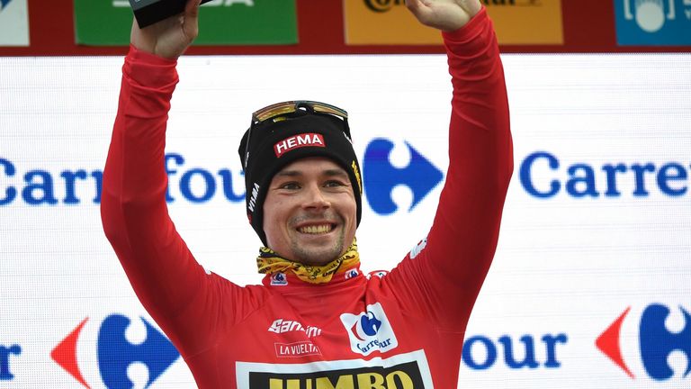 Team Jumbo's Slovenian rider Primoz Roglic celebrates on the podium