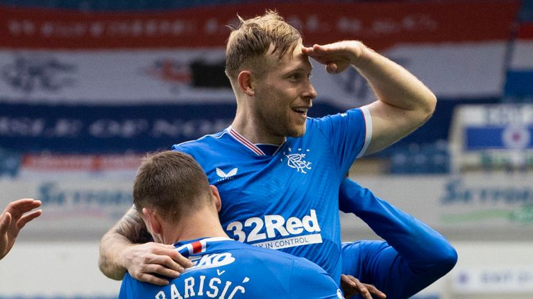 Rangers' Scott Arfield (centre) celebrates with Borna Barisic after making it 3-0 during a Scottish Premiership match between Rangers and Aberdeen at Ibrox