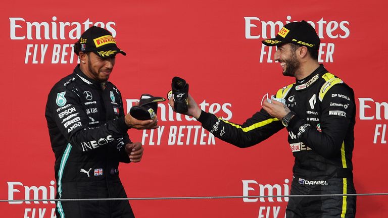 Lewis Hamilton and Daniel Ricciardo share a shoey