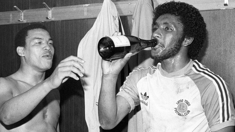 Luton Town returned to the First Division when they beat Shrewsbury Town 4-1. Celebrating after the game with champagne is Brian Stein (left) and Ricky Hill.