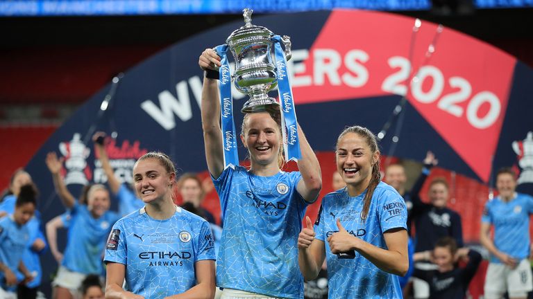 Georgia Stanway, Sam Mewis and Janine Beckie of Manchester City celebrate with the Vitality Women&#39;s FA Cup Trophy following their team&#39;s victory in the Vitality Women&#39;s FA Cup Final match between Everton Women and Manchester City Women at Wembley Stadium on November 01, 2020 in London, England.
